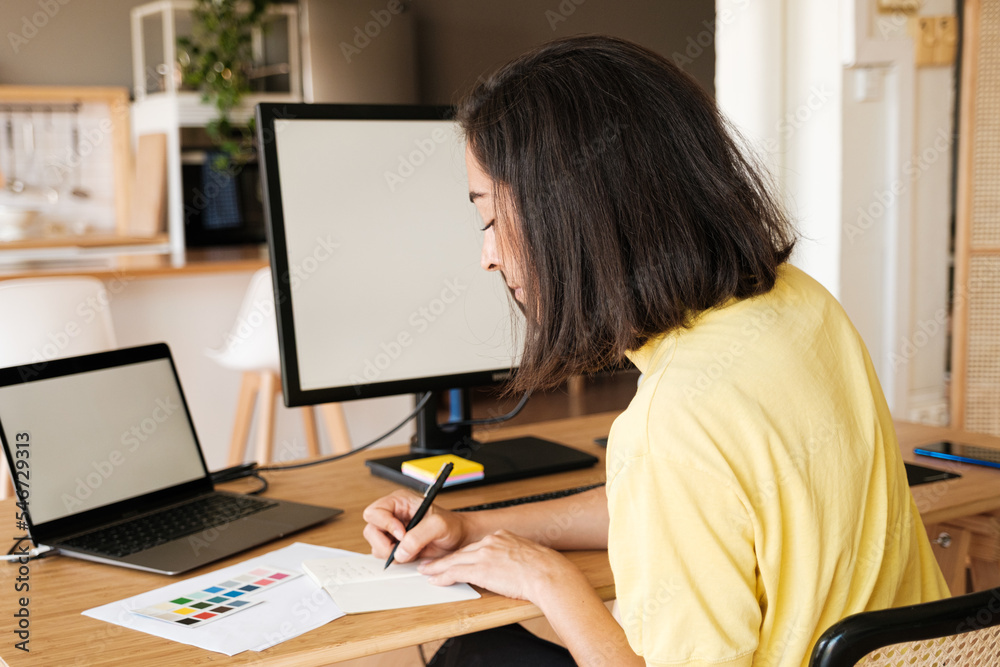 Entrepreneur woman working on computer Entrepreneur woman working on computer
