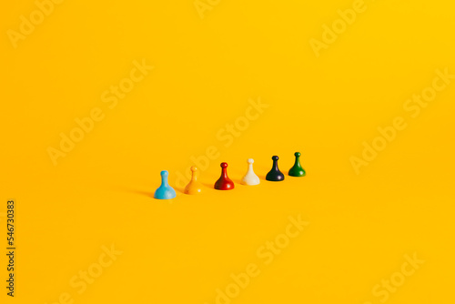 Colorful Board Game pieces on a vibrant yellow background