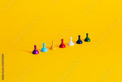 Colorful Board Game pieces on a vibrant yellow background