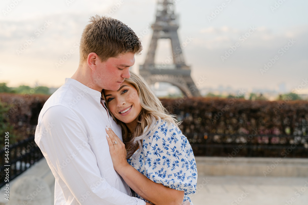 smiling couple by Eiffel tower smiling couple by Eiffel tower