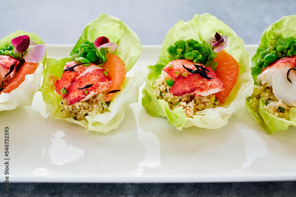 Beautiful appetizer of Lobster salad cups with flowers Beautiful appetizer of Lobster salad cups with flowers