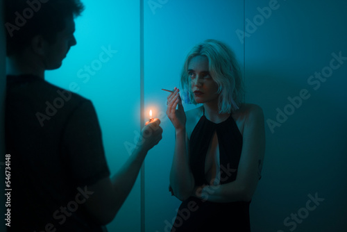 Falling in love lighting up a cigarette at the club