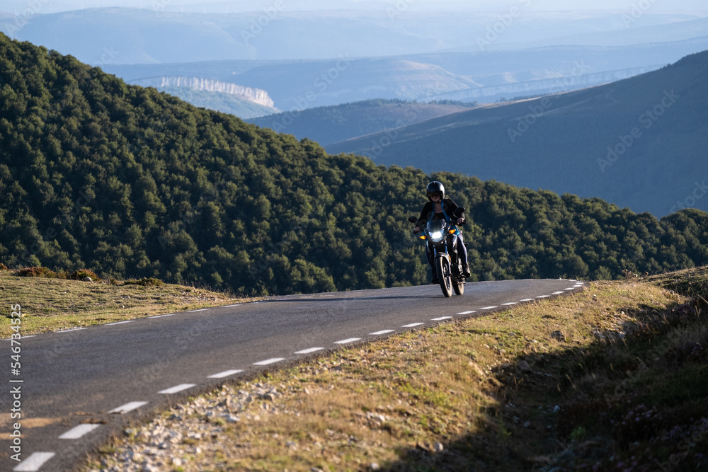 motorcyclist on a mountainroad motorcyclist on a mountainroad