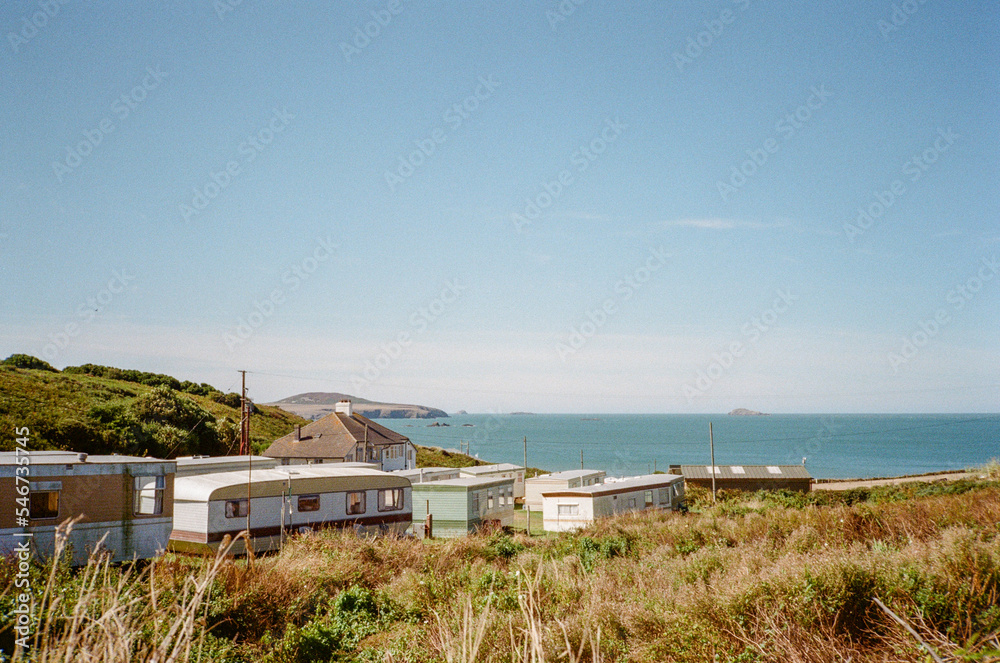 Analogue image of the Welsh coast with static caravans. Analogue image of the Welsh coast with static caravans.