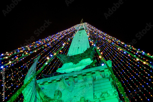 The Soldiers and Sailors monument is decorated with colorful lights at Christmas 