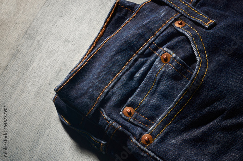 Closeup of jeans sitting on a table photo