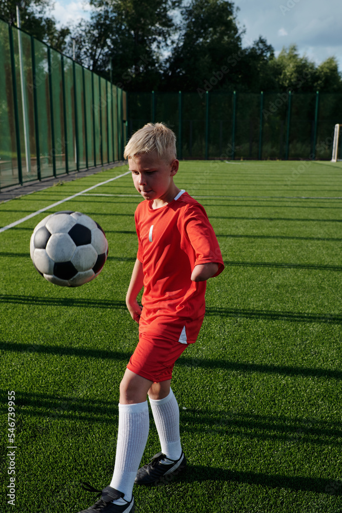Boy With Disability Kicking Ball Boy With Disability Kicking Ball