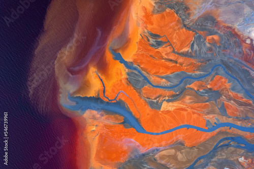 Top view of abstract rivers with vibrant orange and blue colors  photo