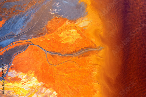 Top view of abstract rivers with vibrant orange and blue colors  photo