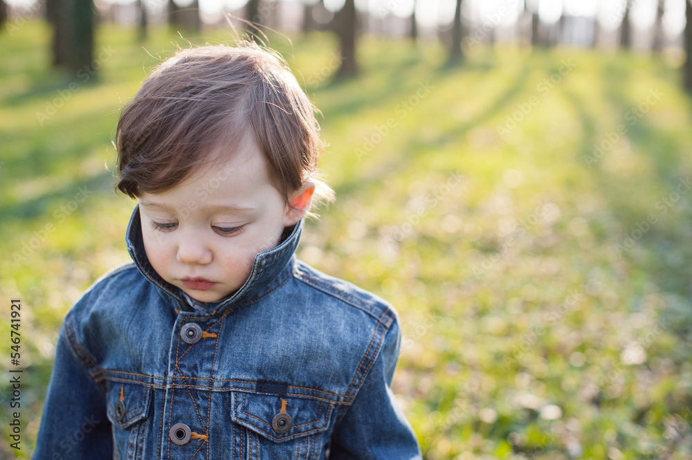 Little boy in a spring park Little boy in a spring park