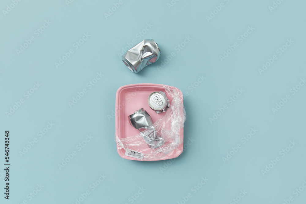 Crushed aluminum cans and plastic pack. Crushed aluminum cans and plastic pack.