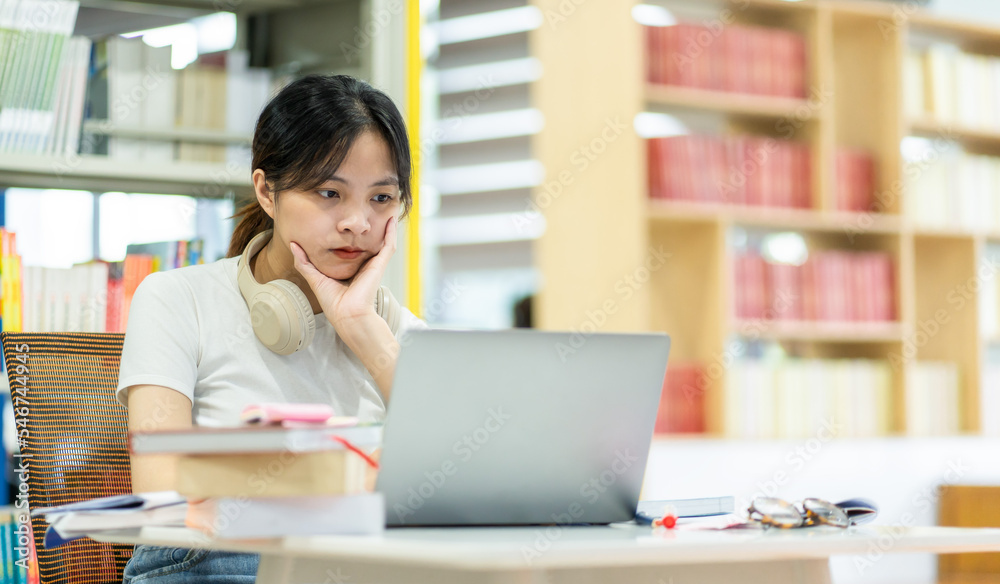 beautiful asian girl studying in the library beautiful asian girl studying in the library
