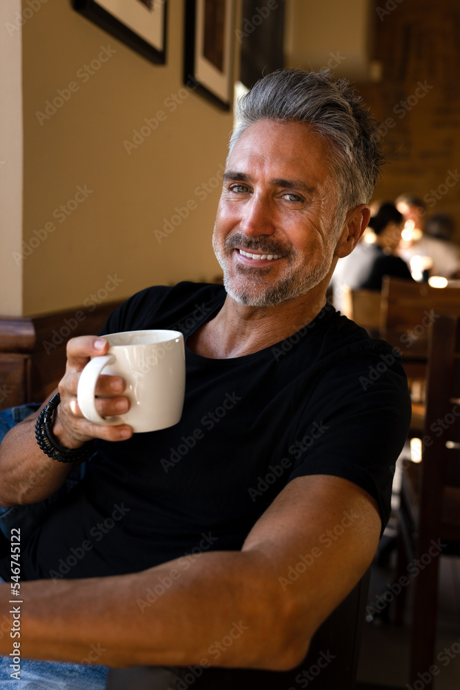 Cheerful senior man with cup of coffee Cheerful senior man with cup of coffee