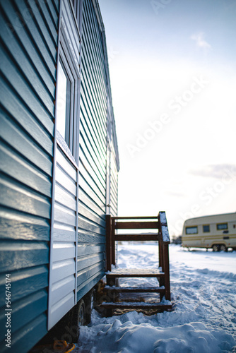 White door and blue wall. 
Beauty winter tiny house.
 photo