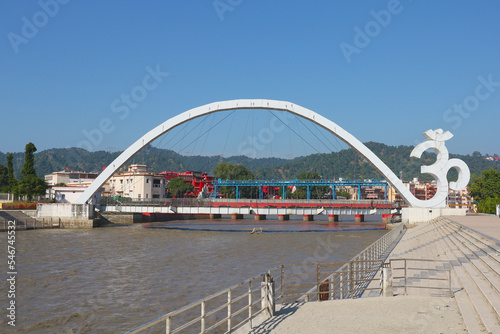 View of the bridge in the shape of the Om symbol connecting the two banks of the Ganges in Haridwar, Uttarakhand, India.