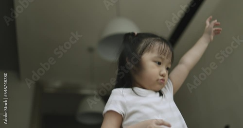 4K Video super slow motion asian kid jumping in trampoline. Video concept for freedom and children in Moment of of joyfully.