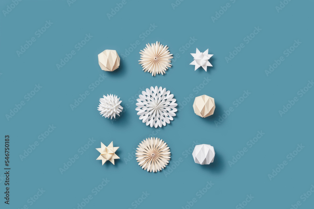 Paper Christmas ornaments on blue background. Paper Christmas ornaments on blue background.