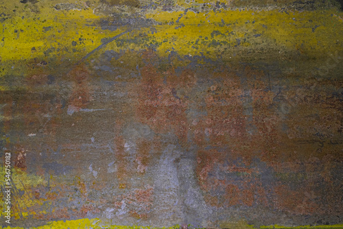 Close up rusted metal with yellow paint panel