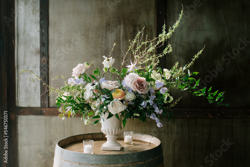 Large Whimsical Flower Arrangement on a Barrel 