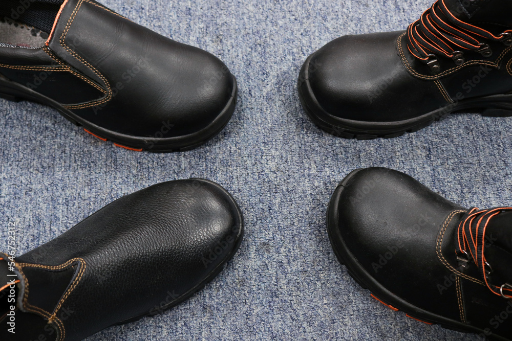 Collection of black leather shoes, usually worn by teenagers Collection of black leather shoes, usually worn by teenagers