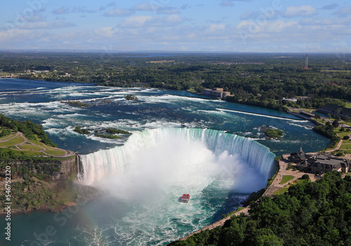 Aerial view of Horseshoe Falls including Hornblower Boat sailing on Niagara River, Canada and USA natural border