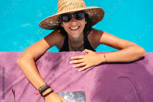 happy woman at the swimming pool photo