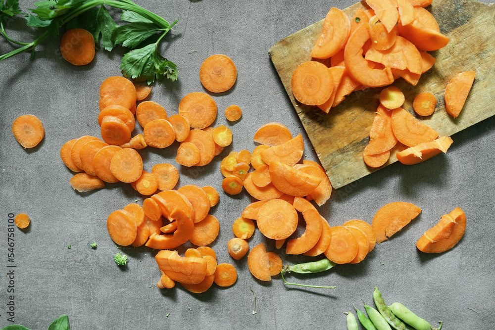 fresh carrots with green leaves on concrete background fresh carrots with green leaves on concrete background