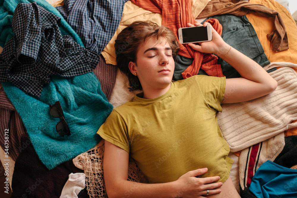 Teenager asleep with his phone Teenager asleep with his phone