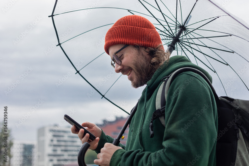hipster under umbrella smiling hipster under umbrella smiling