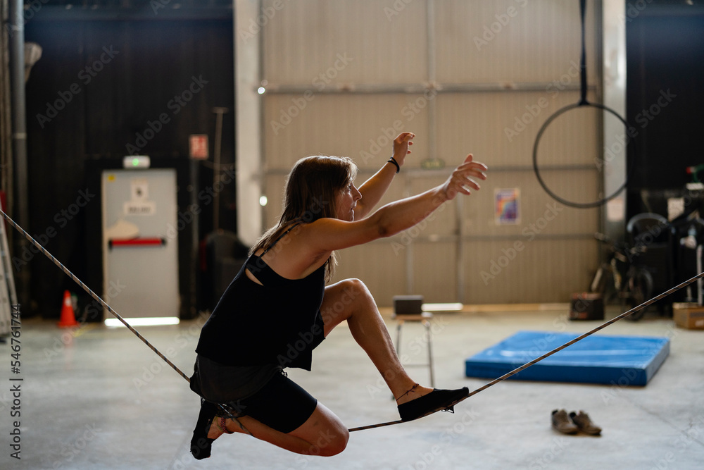 Woman tightrope walker Stock Photo