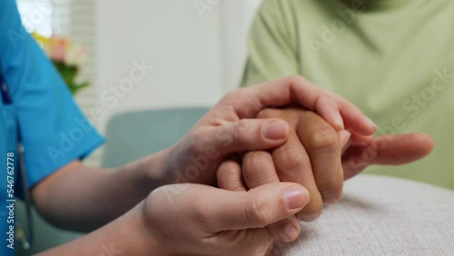International Day for the Elderly. Caring nurse helping elderly old man care facility gets help from hospital, young woman helping hands offering her senior man at home, old aged