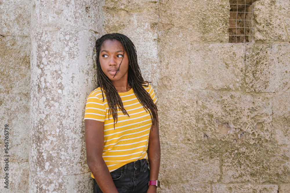 Teen girl by a wall Teen girl by a wall