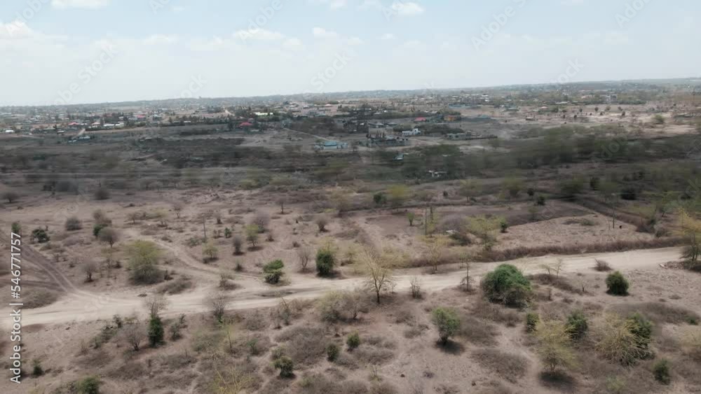 An aerial view of soil and shrubs covering a desert landscape An aerial view of soil and shrubs covering a desert landscape