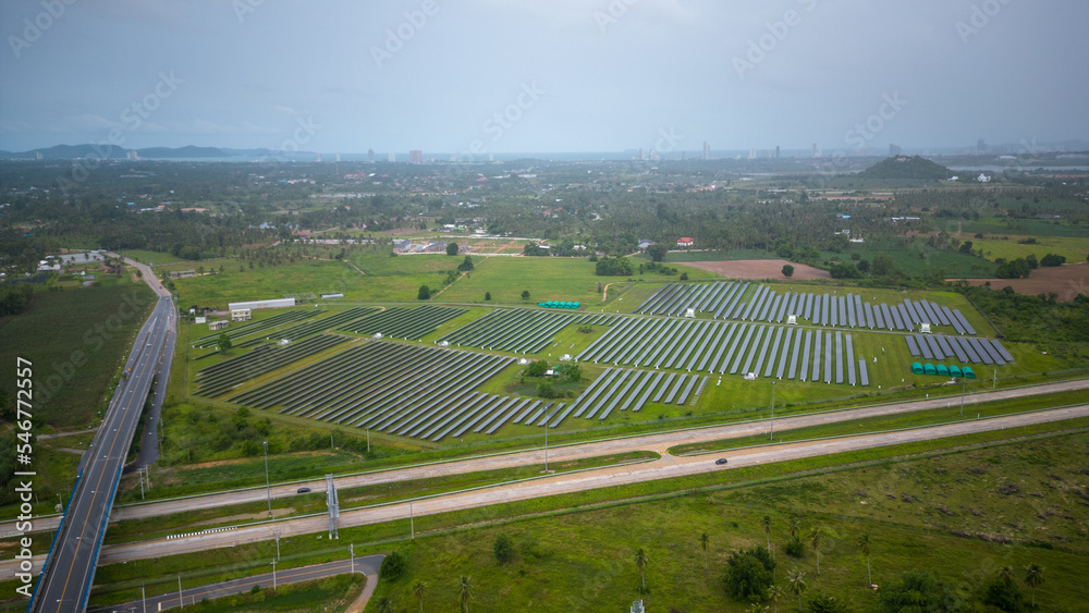 Aerial Photovoltaic in local road with solar farm
