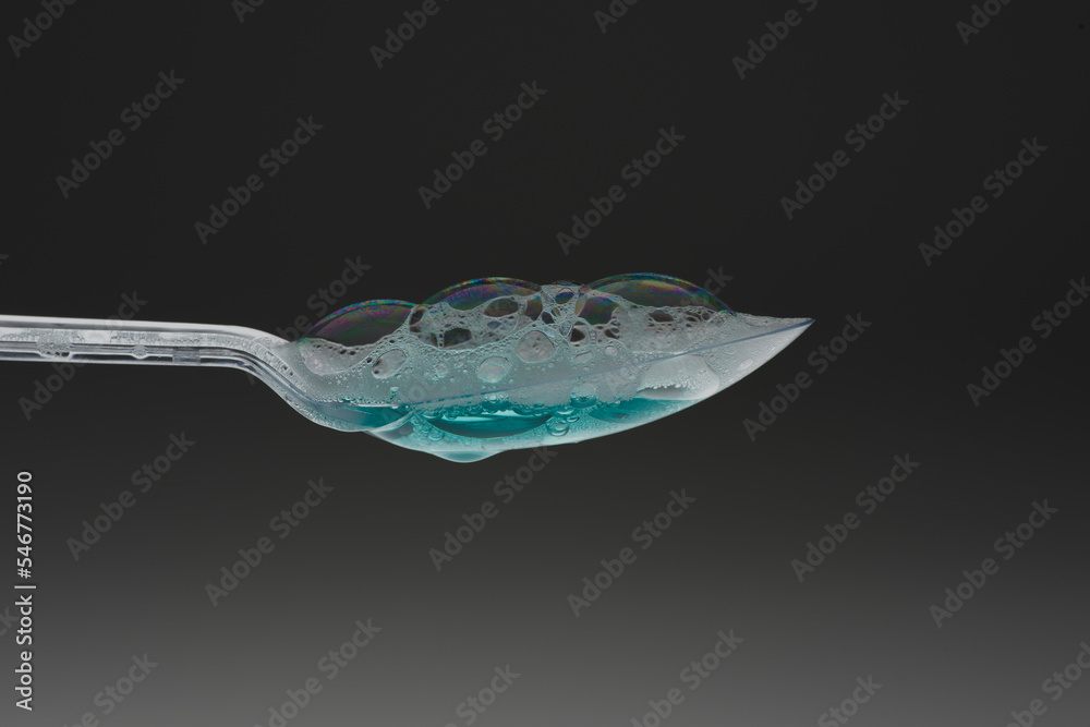 Splashing Spoon Clear plastic spoon with splashing and dripping greensplashing and ...