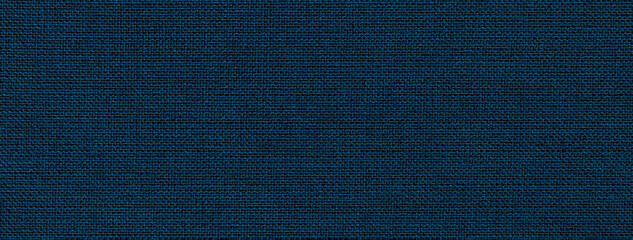 Texture of navy blue color background from textile material with wicker pattern. Structure of vintage fabric