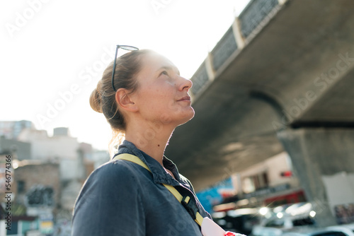young woman looking in the sky