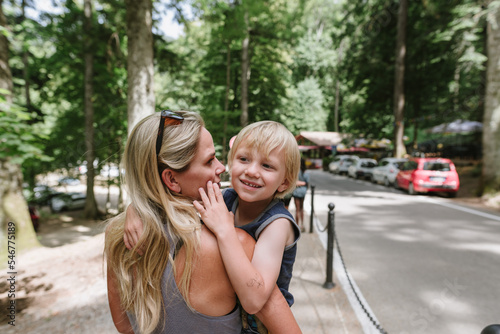 Mom holding son photo