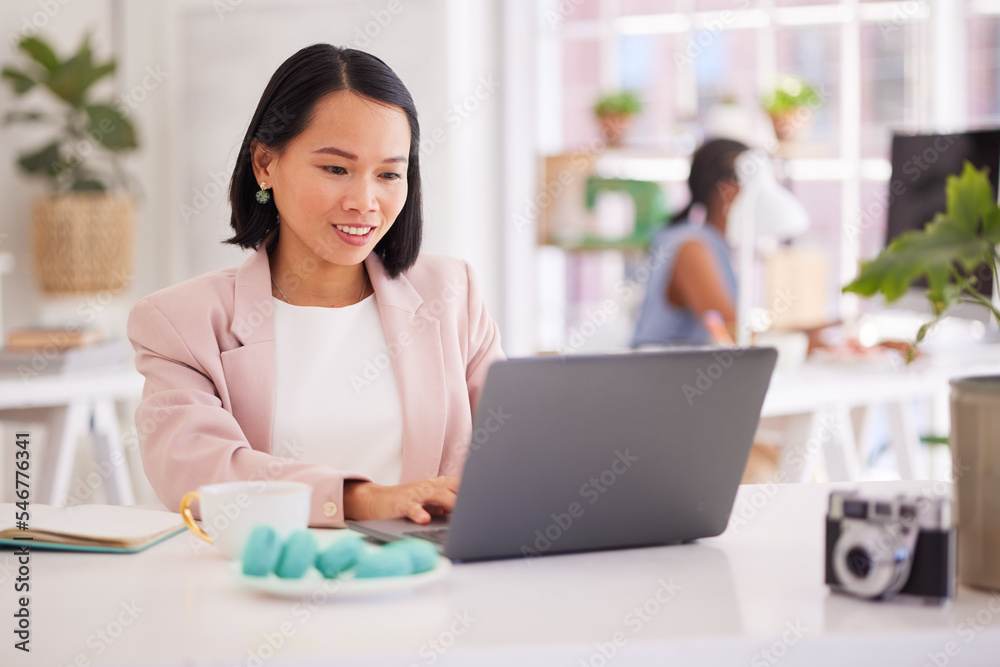 Business woman, laptop and smile for web design, communication or online marketing at the office. Happy female employee working on computer for corporate design, reading or typing email at workplace