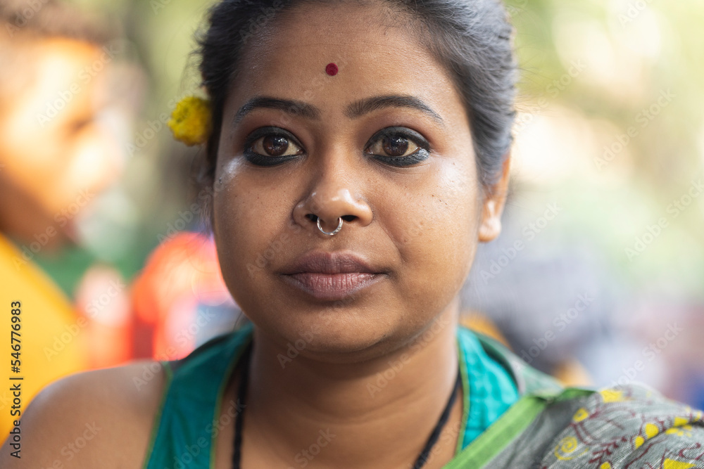 Portrait of an Indian woman wearing traditional sari dress at outdoors Portrait of an Indian woman wearing traditional sari dress at outdoors