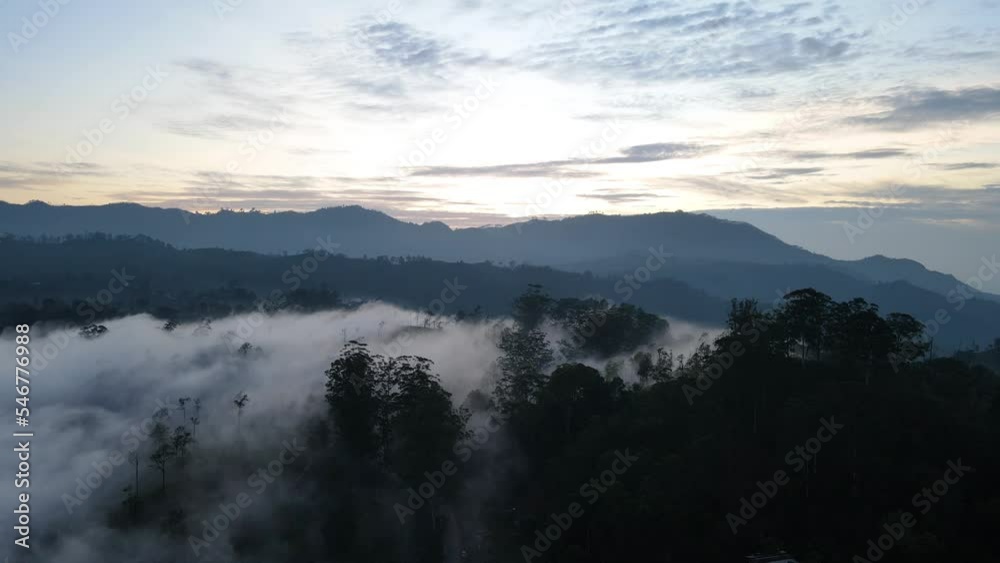 Aerial drone pan shot over Little Adams peak in Sri Lanka on a cloudy morning. Aerial drone pan shot over Little Adams peak in Sri Lanka on a cloudy morning.