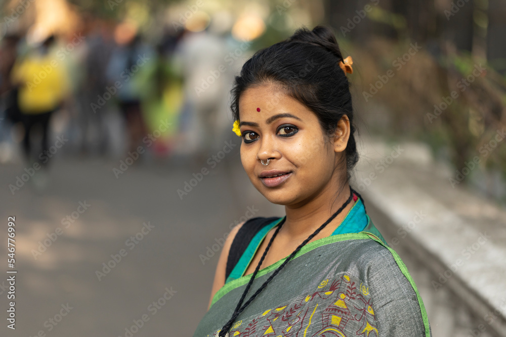 Portrait of an Indian woman wearing traditional sari dress at outdoors Portrait of an Indian woman wearing traditional sari dress at outdoors