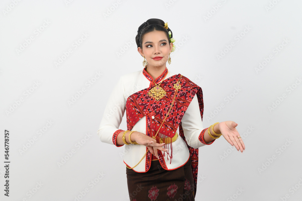 Asian pretty woman in northeastern dress stand in beautiful Thai dance Asian pretty woman in northeastern dress stand in beautiful Thai dance