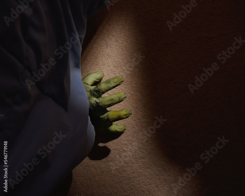 Green Monster Hand Under the Bed photo