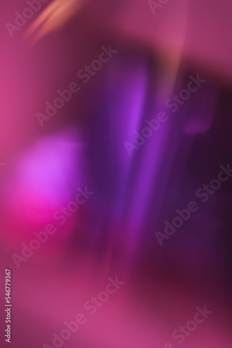 Warm pink, fuchsia and red light reflections inside a prism.