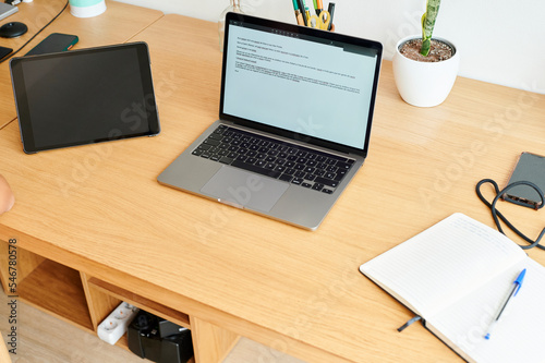 Laptop and tablet on an office desk photo