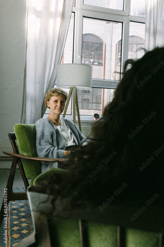 © VISUALSPECTRUM/Stocksy - White Female Therapist in Session With Anonymous Woman