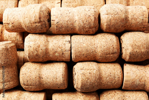 Many corks of wine bottles as background  top view
