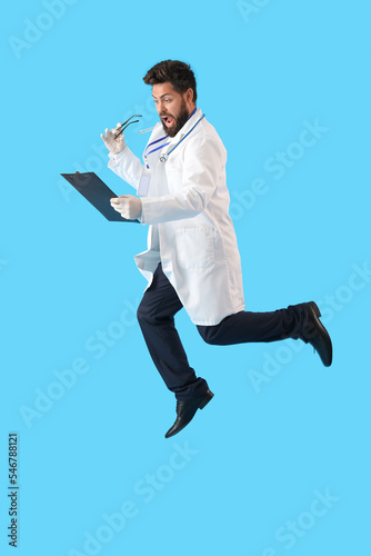 Surprised male doctor with ...