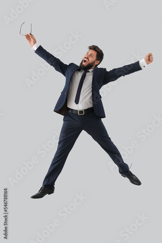 Happy young businessman wit...